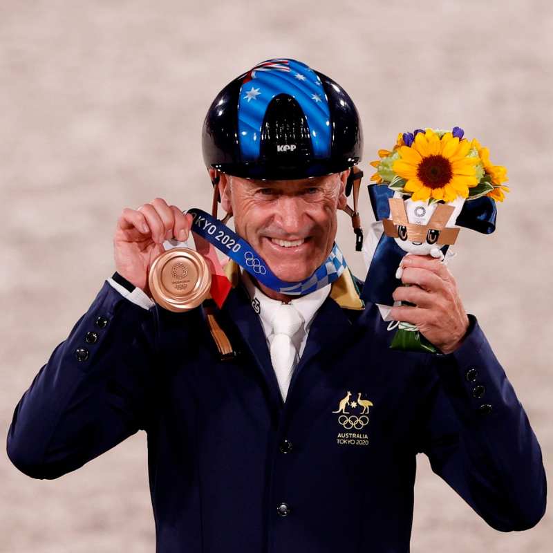 Andrew Hoy with his Olympic medal in Tokyo